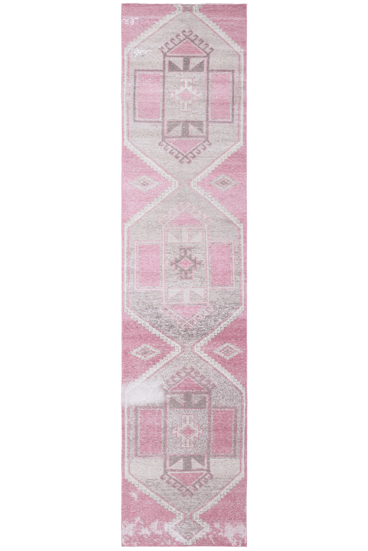 Hand-woven 2x11 ft vintage Turkish runner rug in faded pink and gray with geometric patterns and wool-cotton blend.