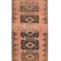 Handmade 4x11 ft vintage Turkish runner rug in orange and brown with geometric tribal patterns and wool-cotton blend.