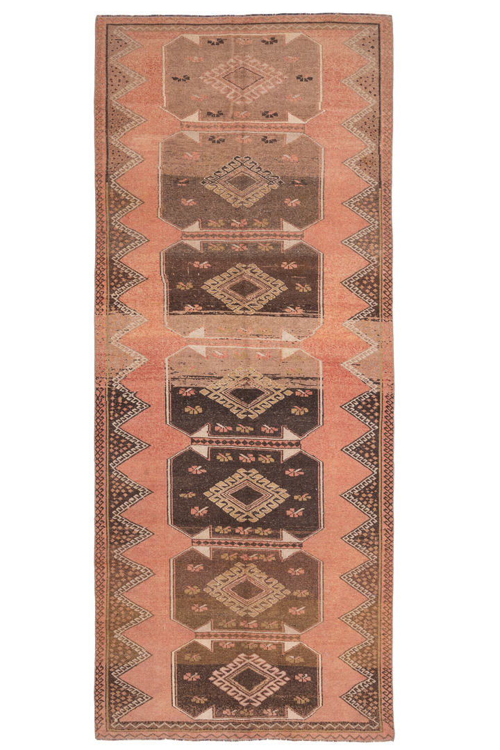 Handmade 4x11 ft vintage Turkish runner rug in orange and brown with geometric tribal patterns and wool-cotton blend.