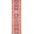 Handmade 2.6x13.5 ft wool and cotton Persian-style runner rug in red and orange with maximalist floral patterns.