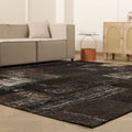 8x9 ft black patchwork vintage Turkish rug with distressed patterns, hand-stitched from wool and cotton in a bohemian style.