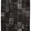8x9 ft black patchwork Turkish area rug featuring distressed, hand-stitched wool and cotton patterns in a bohemian style.