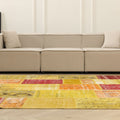 6x9 ft vintage Turkish patchwork area rug featuring vibrant yellow and red floral patterns in wool and cotton.