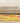 6x9 ft vintage Turkish patchwork area rug featuring vibrant yellow and red floral patterns in wool and cotton.