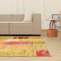6x9 ft vintage Turkish patchwork rug in vibrant yellow and red with floral patterns, made from wool and cotton.