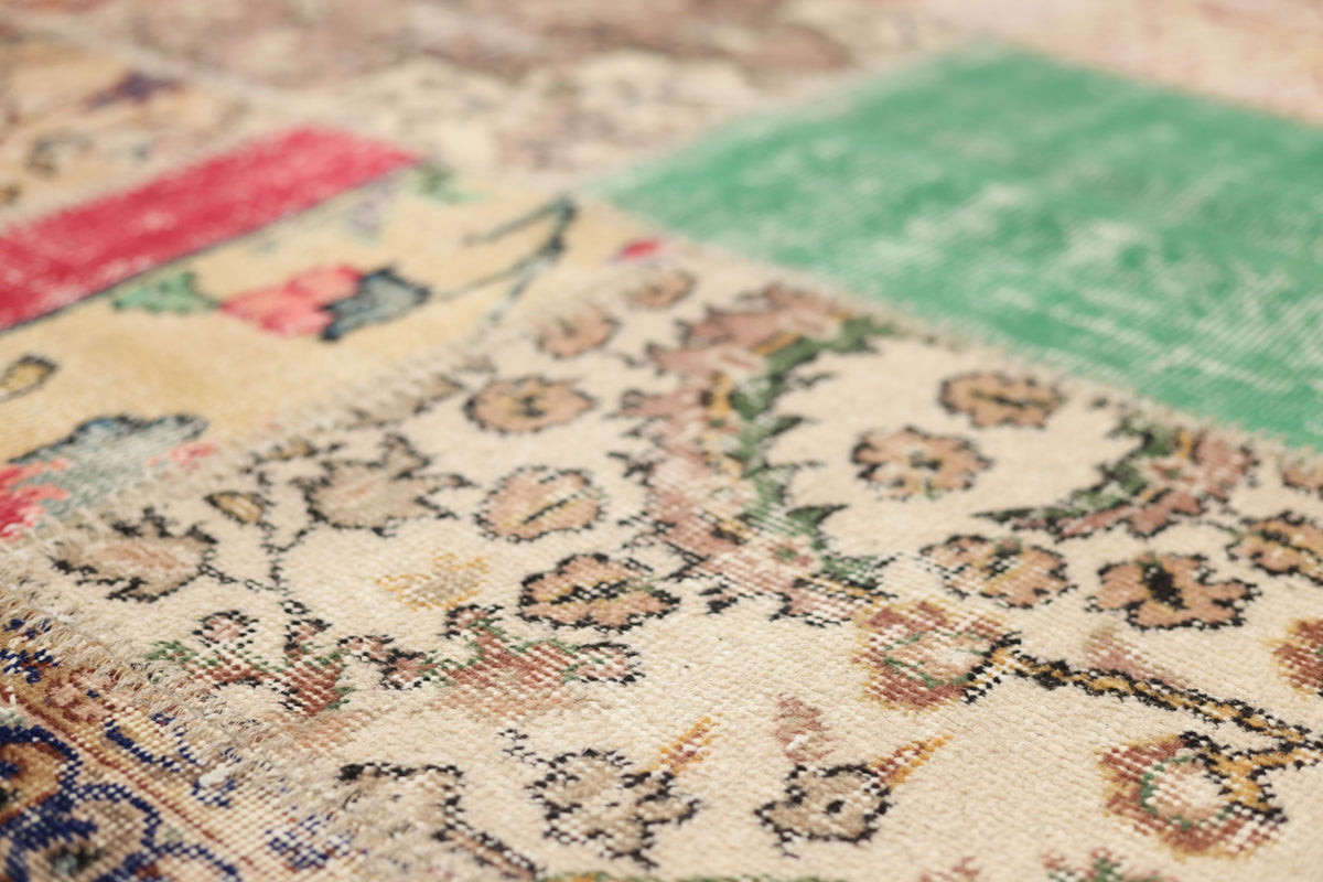Handmade 6x10 ft vintage Turkish patchwork rug featuring colorful floral patterns in wool and cotton.