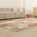 6x9 ft vintage Turkish patchwork area rug with vibrant geometric patterns in wool and cotton on a light wood floor.