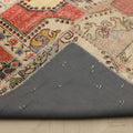 Handmade 6x9 patchwork Turkish rug with vibrant geometric patterns, wool and cotton construction, and grey fabric backing.