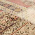Handmade vintage Turkish patchwork rug with geometric patterns in wool and cotton, featuring a vibrant mix of colors.