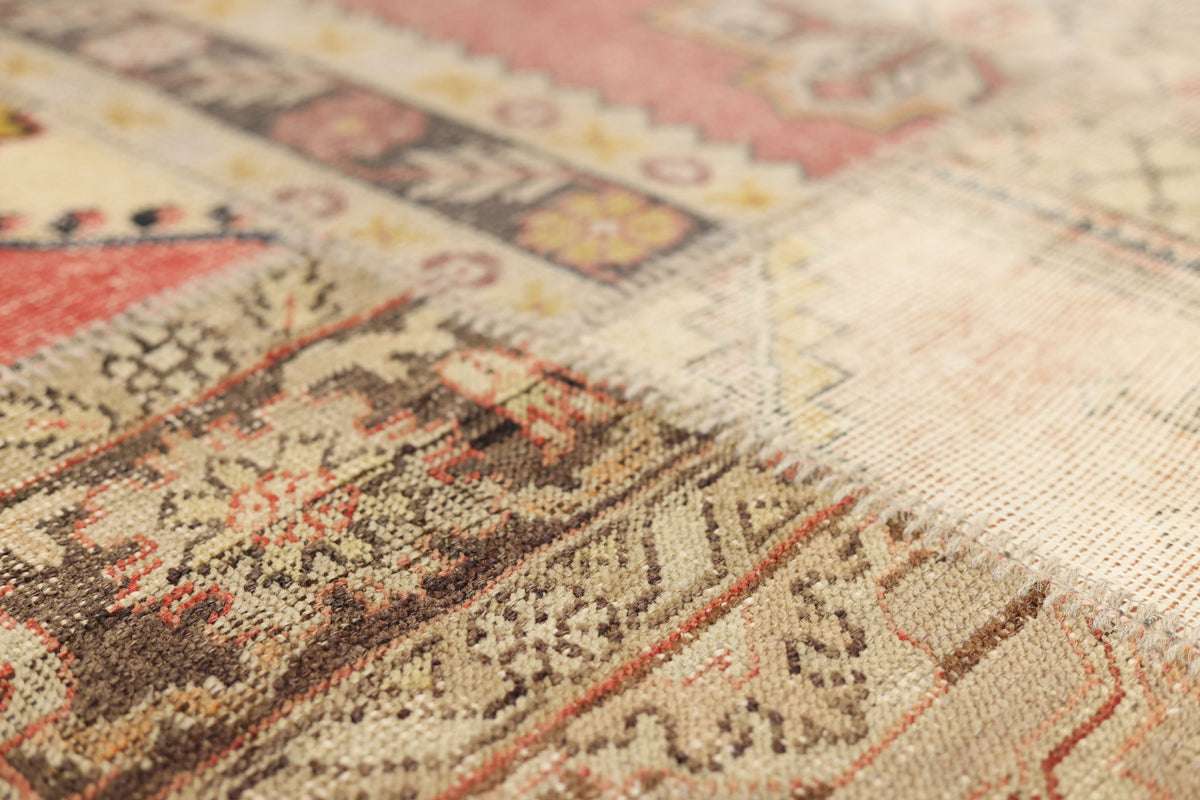 Handmade vintage Turkish patchwork rug with geometric patterns in wool and cotton, featuring a vibrant mix of colors.