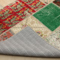 Handmade 6x9 patchwork Turkish rug featuring vibrant floral wool and cotton patterns with a gray fabric backing.
