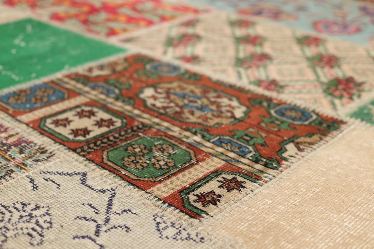 Handmade 6x9 ft vintage Turkish patchwork rug featuring vibrant floral patterns in wool and cotton.
