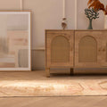 Vintage 2x11 ft hand-woven Turkish runner rug in beige and red with geometric patterns on a wooden floor.