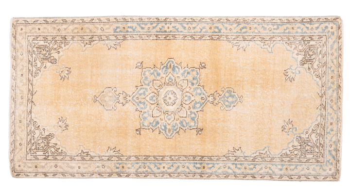Handmade vintage Isparta runner rug in yellow and beige wool with traditional floral medallion patterns.