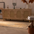 Handmade vintage Isparta runner rug in yellow and beige with traditional floral patterns on a wooden floor.