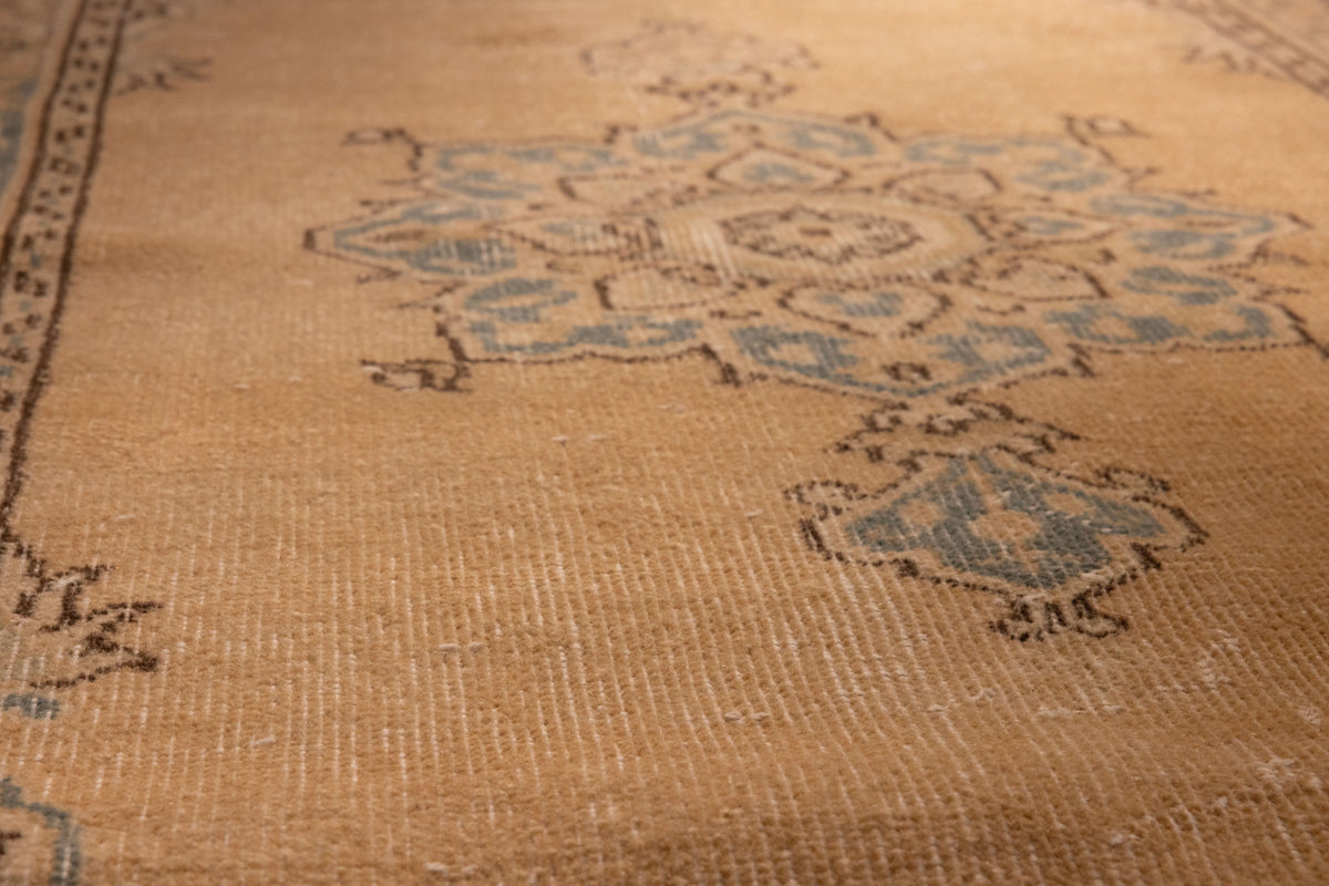 Hand-woven vintage Isparta runner rug in yellow and beige wool with traditional floral patterns.