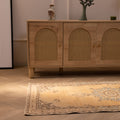 Handmade vintage Isparta Turkish runner rug in yellow and beige wool with traditional floral patterns.