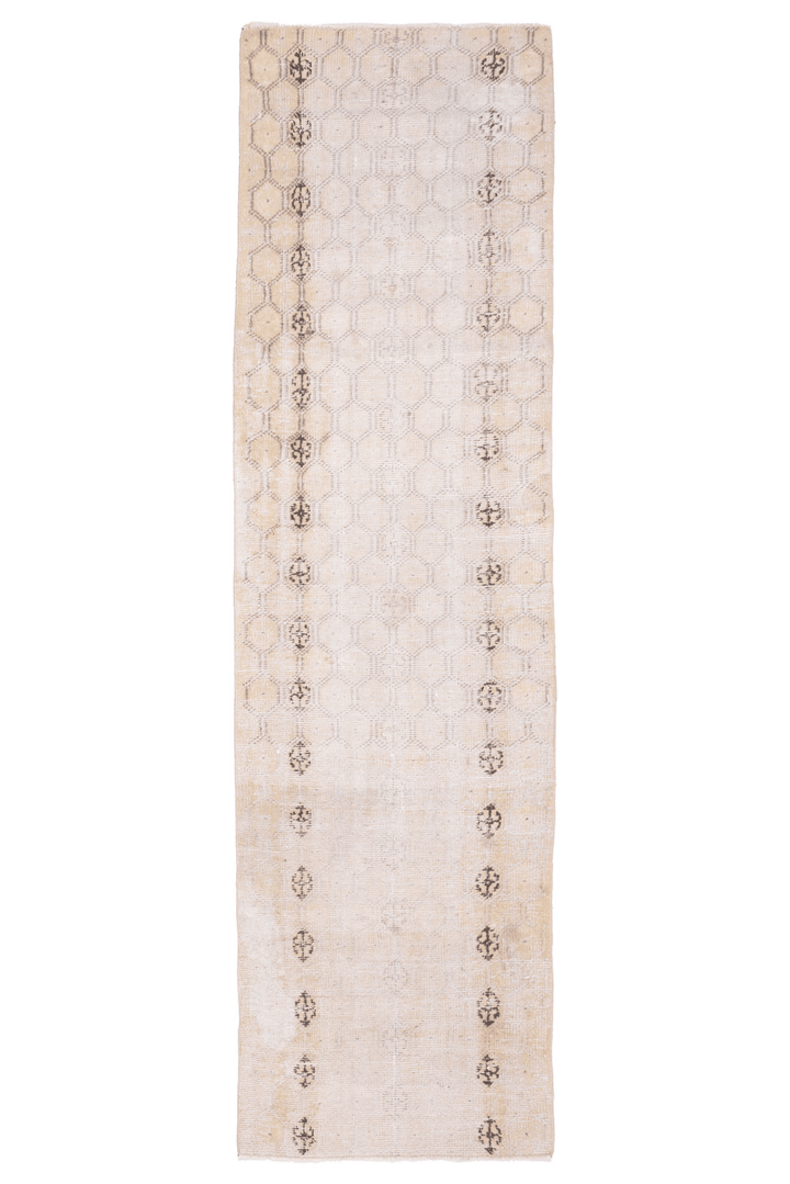 Hand-woven vintage Isparta runner rug in beige and white with geometric patterns, crafted from wool and cotton.