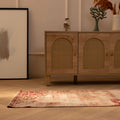 Vintage red floral Isparta Turkish runner rug in wool and cotton on a wooden floor in a bohemian interior.