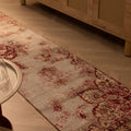 Vintage red and white floral Isparta runner rug, hand-woven wool and cotton, displayed on a herringbone wood floor.