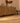 Vintage 2x4 ft orange floral Turkish Isparta wool and cotton area rug on a wooden floor in a bohemian room.