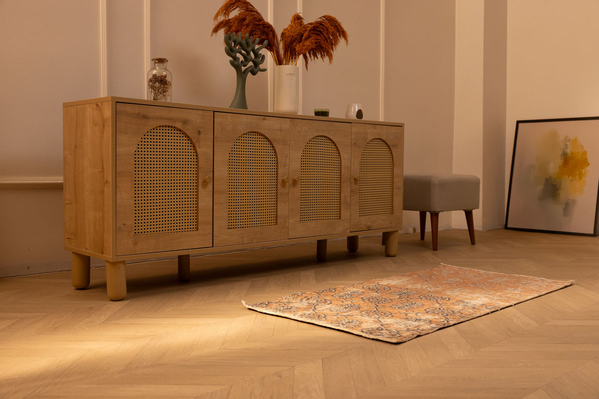 Vintage 2x4 ft orange floral Turkish Isparta wool and cotton area rug on a wooden floor in a bohemian room.