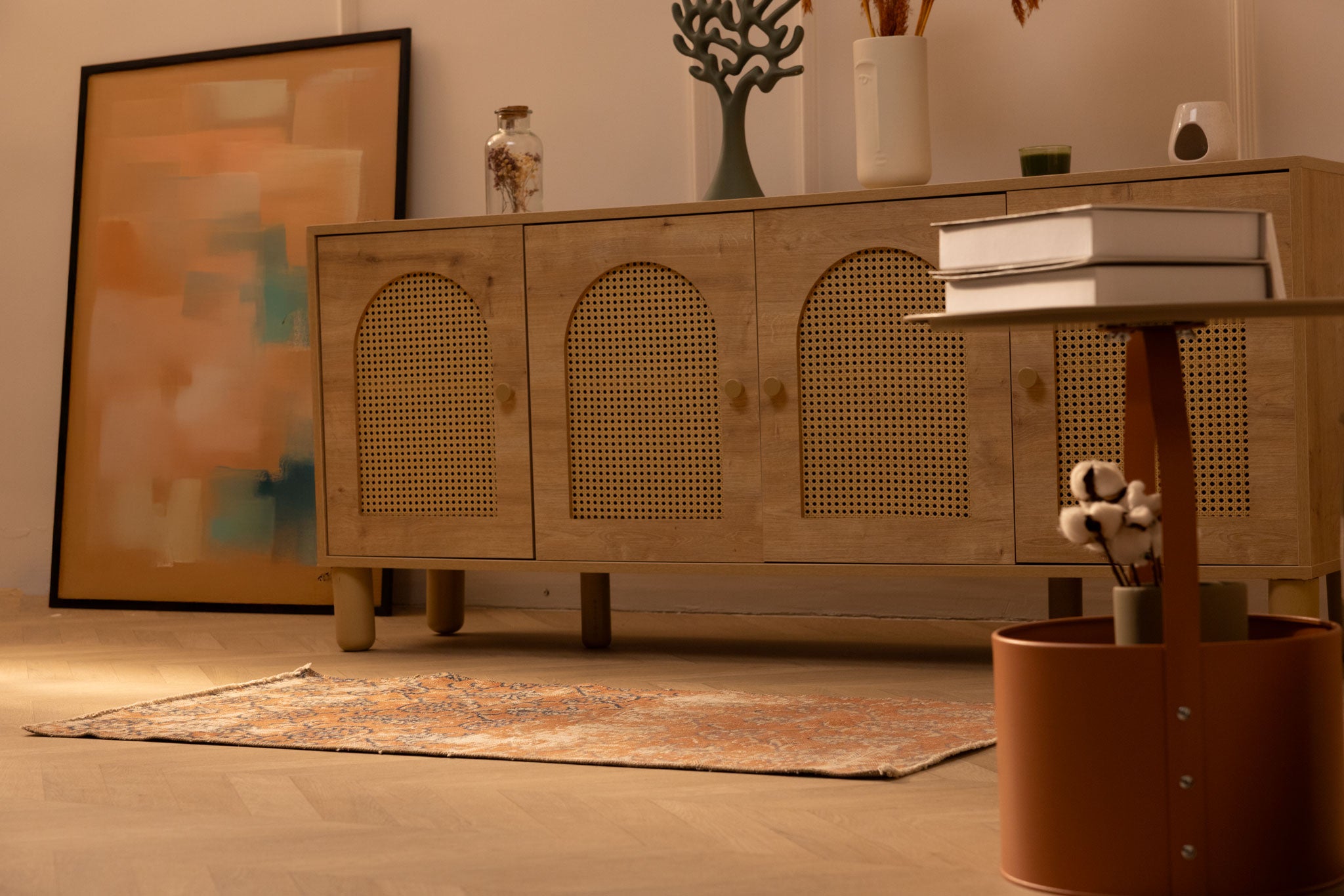 Vintage 2x4 ft Isparta wool and cotton rug with burnt-orange floral patterns in a bohemian living room setting.
