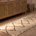 Handmade 2.9x7.6 ft wool and cotton runner rug in white and brown with a geometric farmhouse pattern.