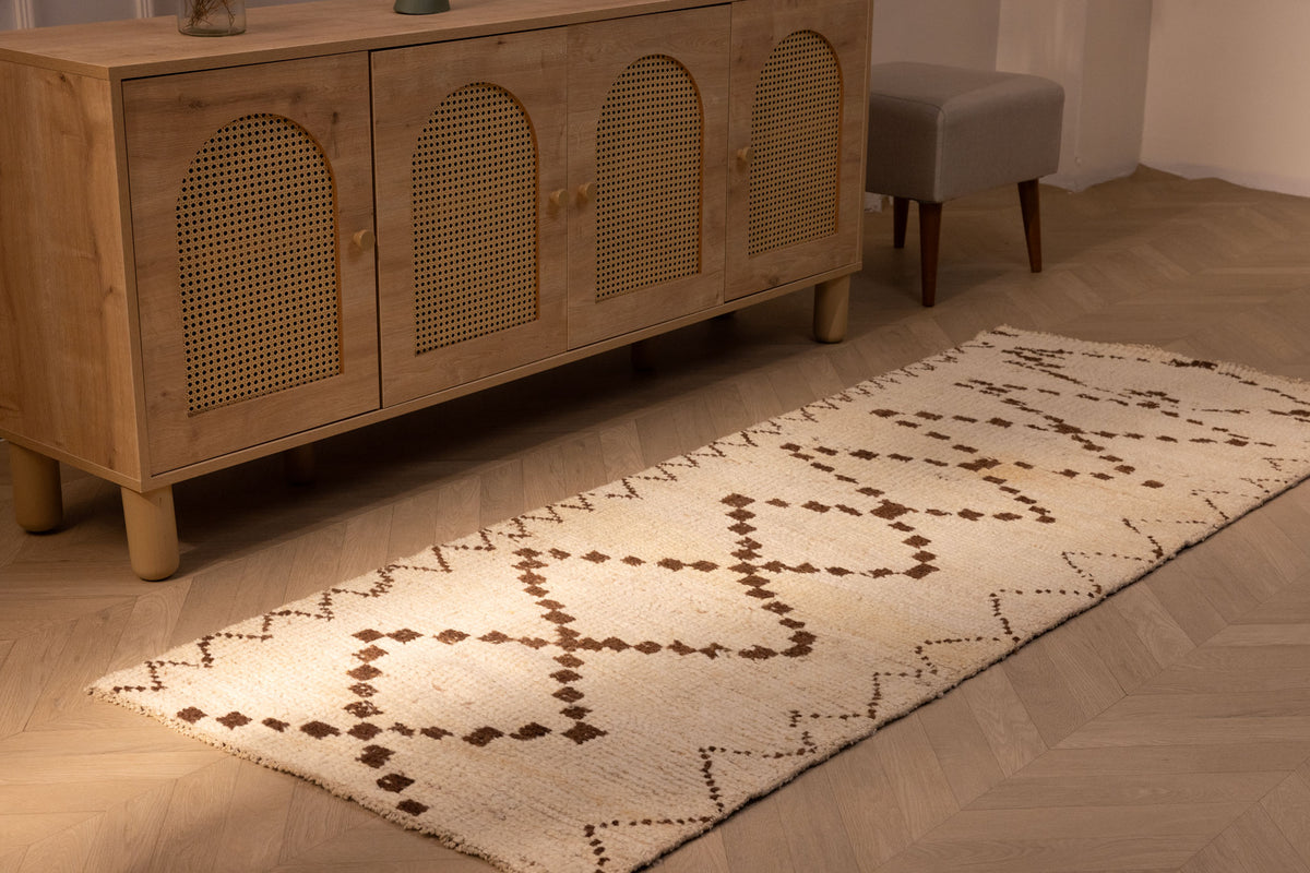 Handmade 2.9x7.6 ft wool and cotton runner rug in white and brown with a geometric farmhouse pattern.