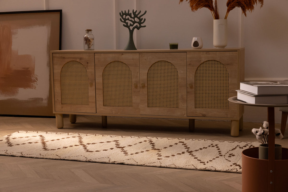 Handmade white and brown wool-cotton Persian-style runner rug with geometric patterns on a wooden floor.