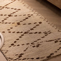 Handmade 2.9x7.6 ft wool and cotton runner rug in white and brown with a geometric farmhouse pattern.