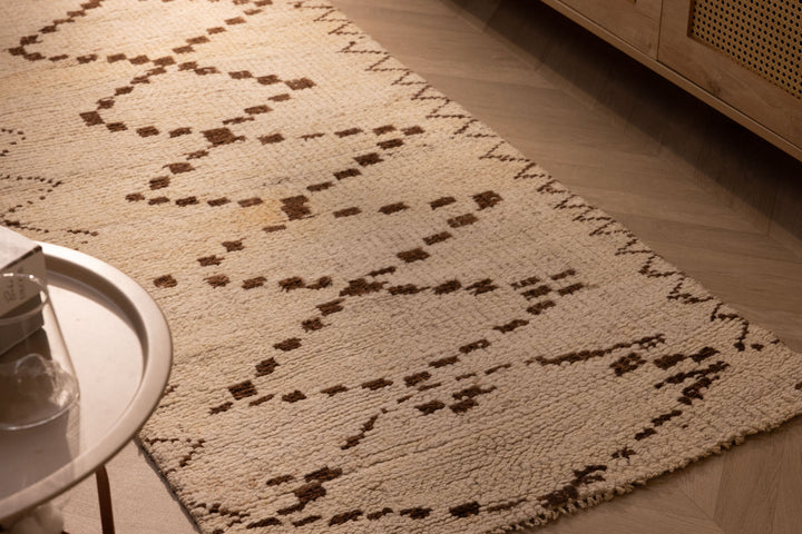 Handmade 2.9x7.6 ft wool and cotton runner rug in white and brown with a geometric farmhouse pattern.
