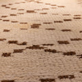 Handmade 2.9x7.6 ft wool and cotton runner rug in white and brown with a geometric farmhouse pattern.