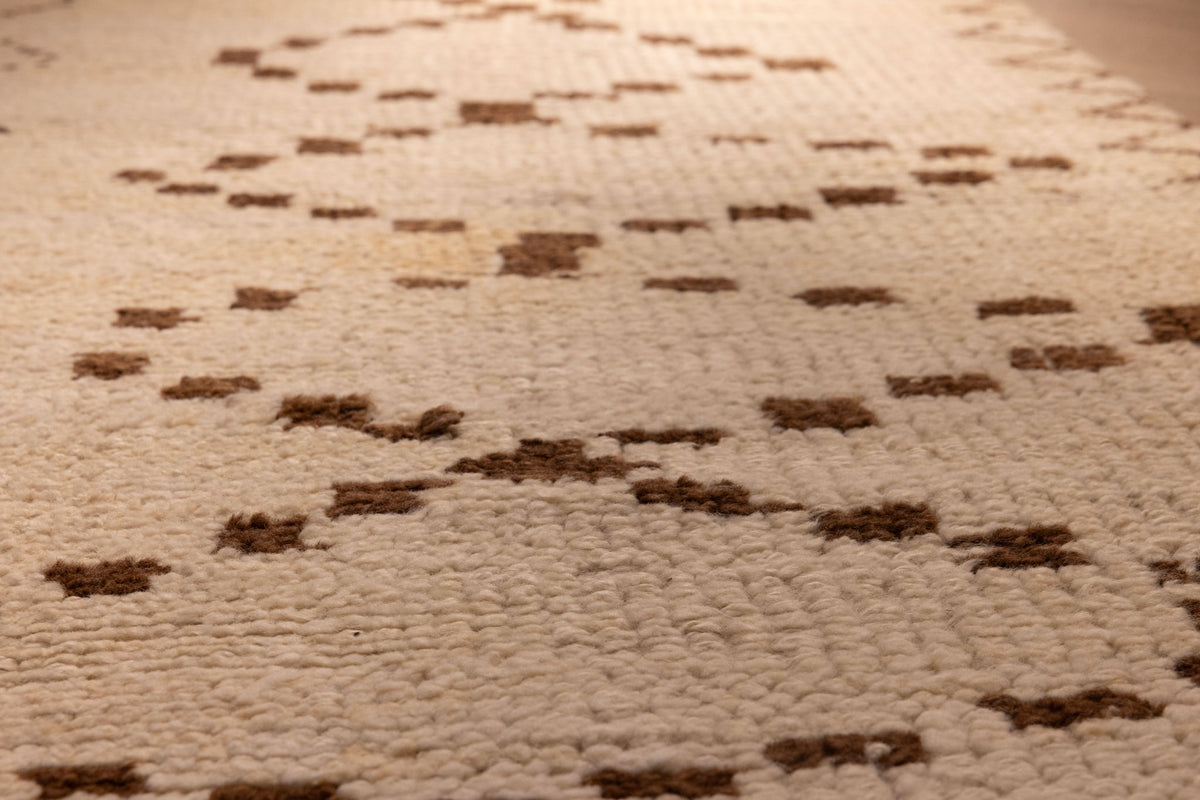 Handmade 2.9x7.6 ft wool and cotton runner rug in white and brown with a geometric farmhouse pattern.