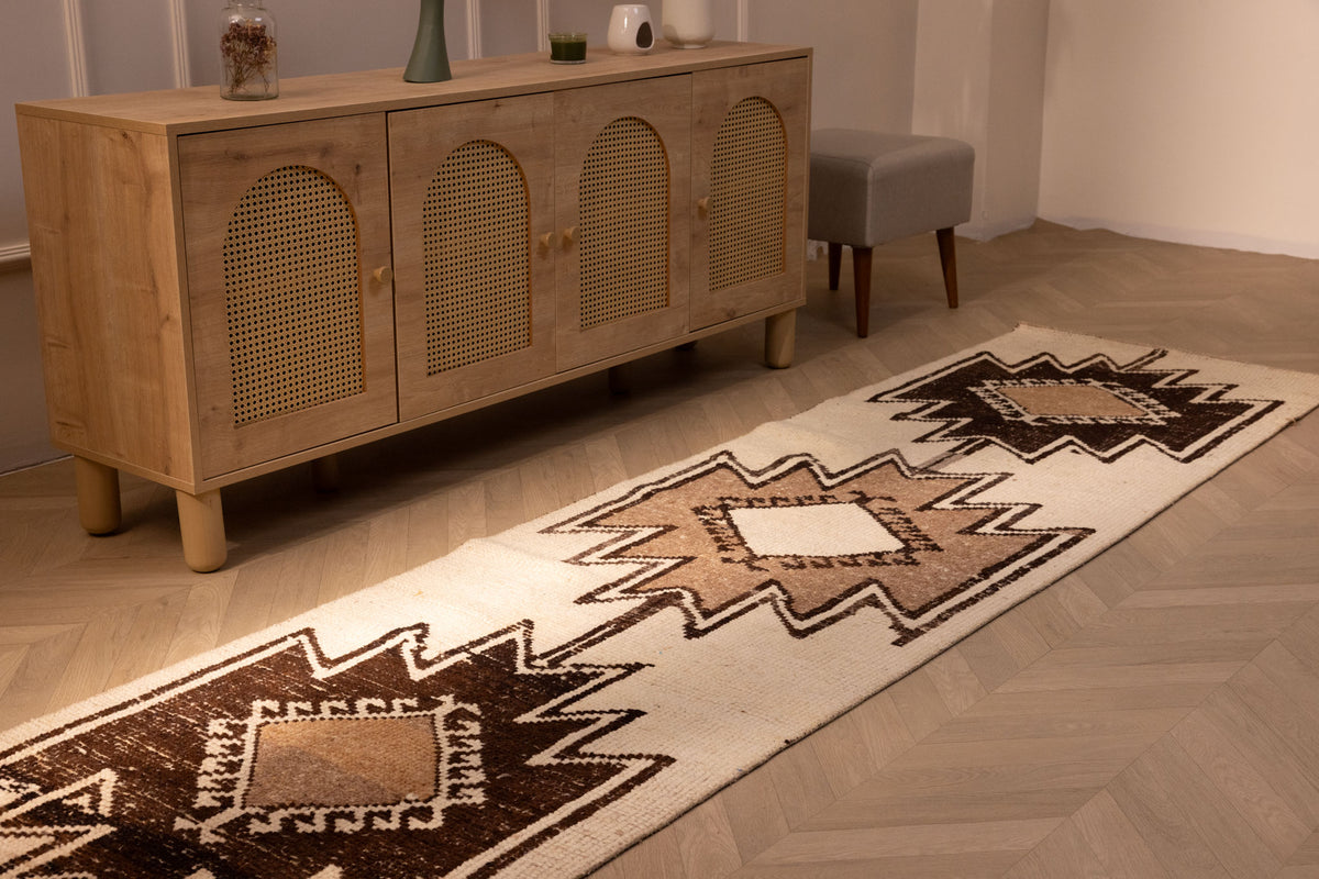 Handmade 2.9x10.8 ft wool and cotton runner rug featuring white and brown geometric Persian-style patterns.
