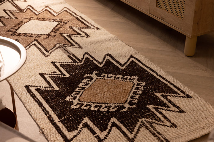 Handmade 2.9x10.8 ft wool and cotton runner rug featuring white and brown geometric patterns in a farmhouse style.