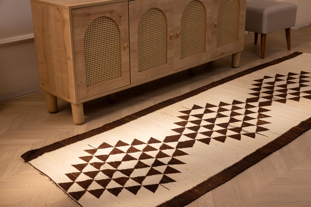 Handmade white and brown geometric wool-cotton runner rug, 3.3 x 10.4 ft, featuring a farmhouse-style flatweave design.