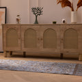 Vintage navy overdyed Turkish runner rug with intricate floral patterns in a bohemian hallway setting.
