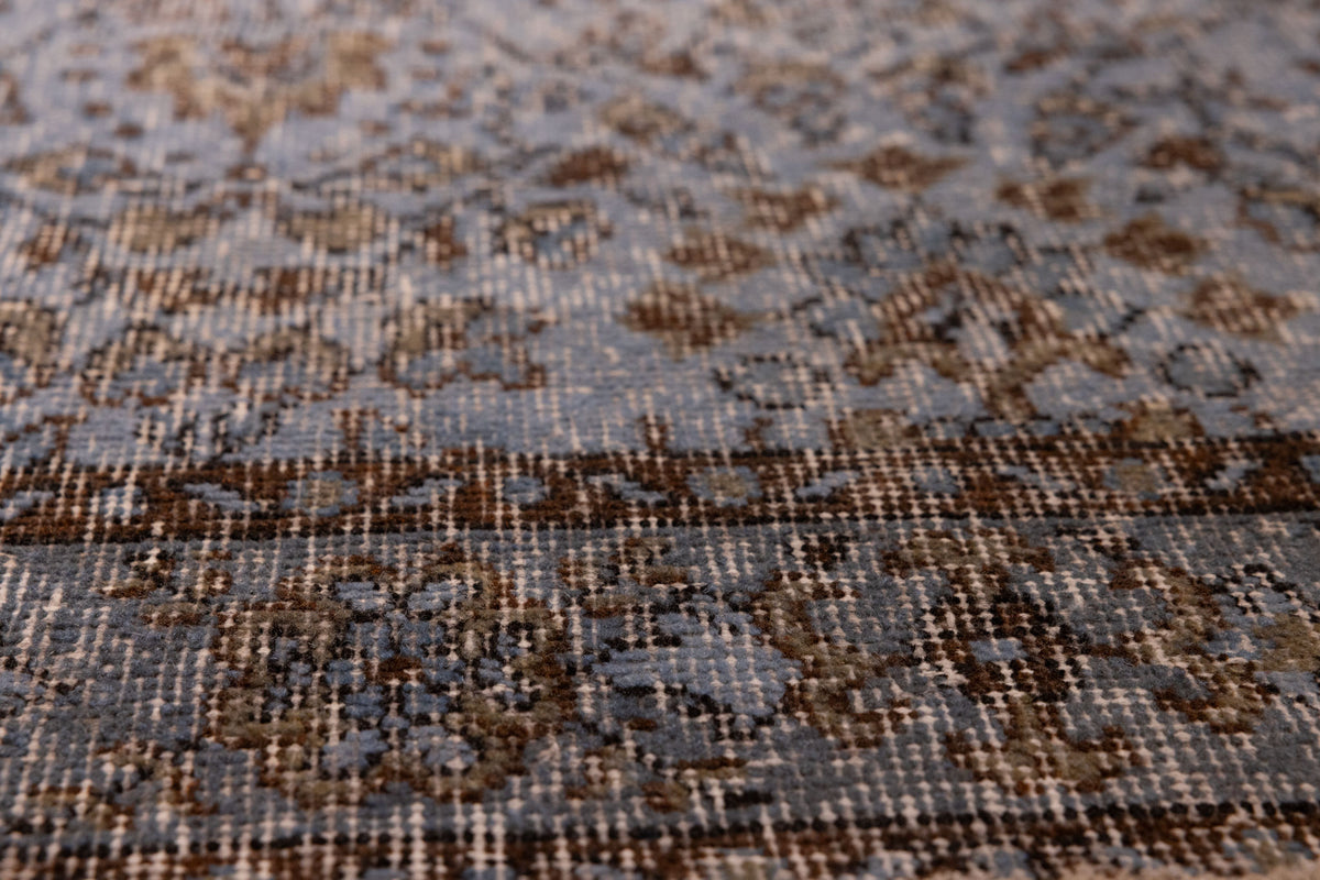 Vintage navy overdyed Turkish runner rug with intricate floral patterns and a soft wool-cotton blend texture.