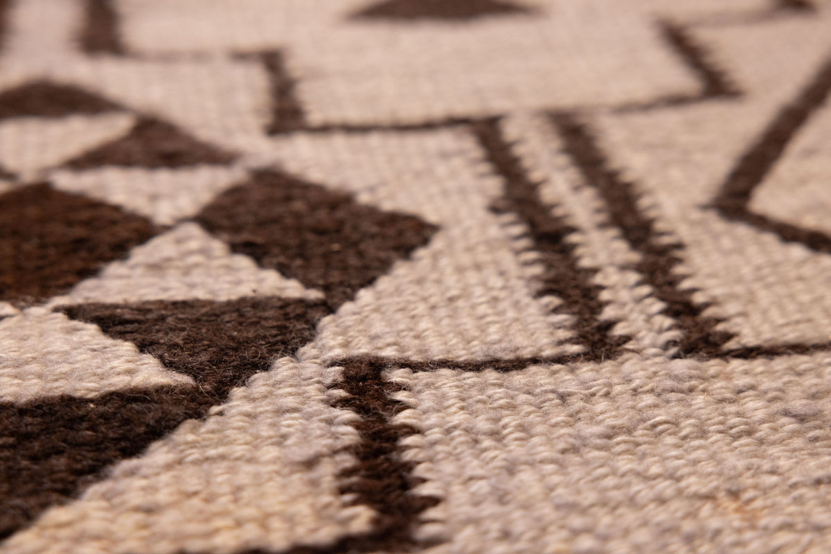 Handmade gray and brown wool-cotton flatweave kilim runner with geometric farmhouse patterns.