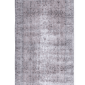 Hand-woven 3x6 ft vintage Isparta rug in smoky gray with overdyed floral patterns and rustic wool-cotton blend.