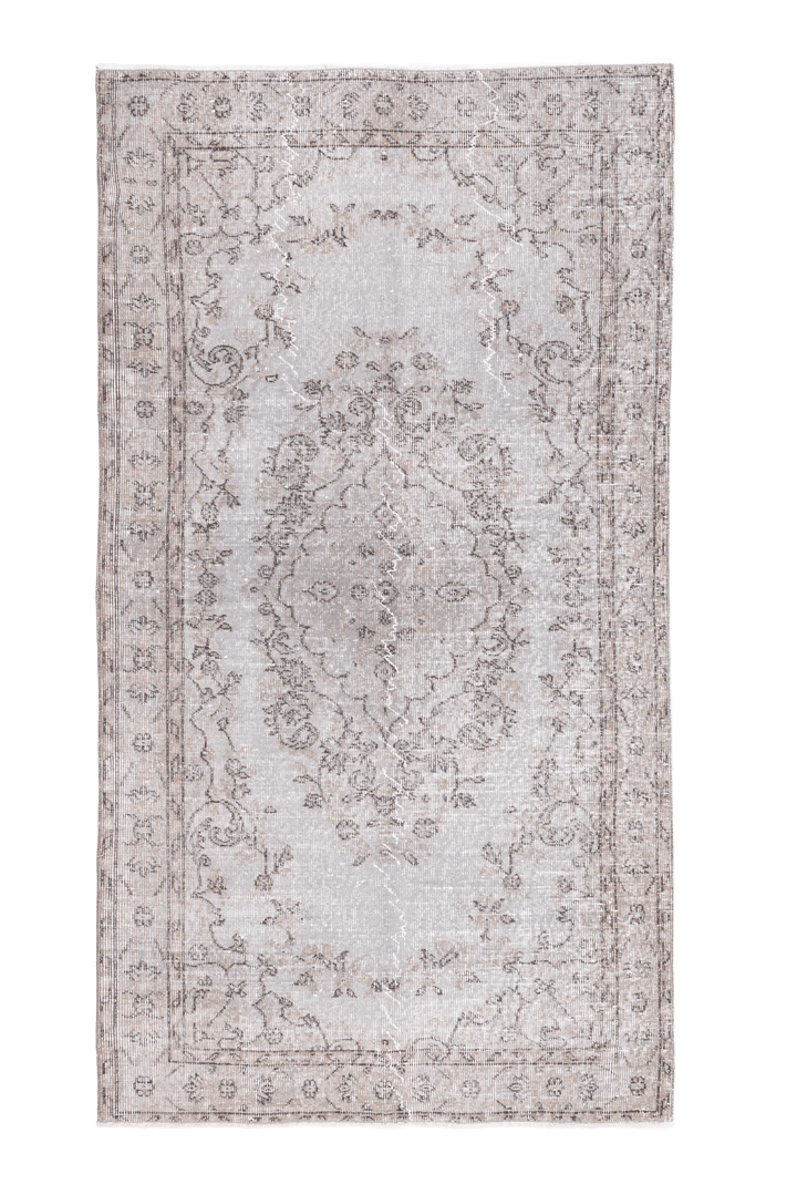 Hand-woven 3x6 ft vintage Isparta Turkish rug in overdyed gray wool and cotton with intricate floral patterns.