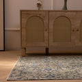 Hand-woven vintage Isparta rug in gray and navy floral patterns, 3x3 ft wool and cotton blend in a bohemian interior.