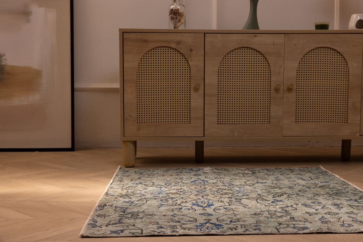 Hand-woven vintage Isparta rug in gray and navy floral patterns, 3x3 ft wool and cotton blend in a bohemian interior.
