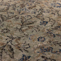 Hand-woven vintage Isparta wool and cotton rug in gray and navy with a detailed bohemian floral pattern.