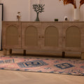 Handmade 3.5x9.9 ft wool and cotton Persian-style runner rug in pink and navy with geometric bohemian patterns.