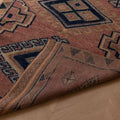 Handmade 3.5x9.9 ft wool and cotton runner rug in pink and navy with bohemian geometric patterns.