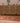 Handmade 2.9x12.5 ft Persian-style runner rug in red and brown wool-cotton blend with bohemian geometric patterns.