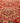 Handmade wool and cotton runner rug in red and brown with geometric bohemian patterns.