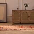 Handmade 2.5x13.4 ft wool and cotton Persian-style runner rug in brown and beige with bohemian floral and geometric patterns.